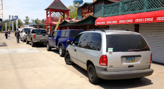 Vehicles parked along the midway